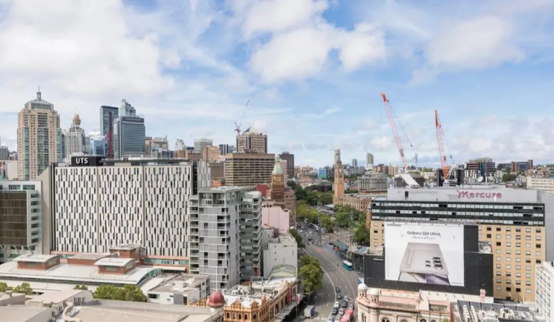 Facing the UTS headquarters, gazing into the distant Sydney cityscape.